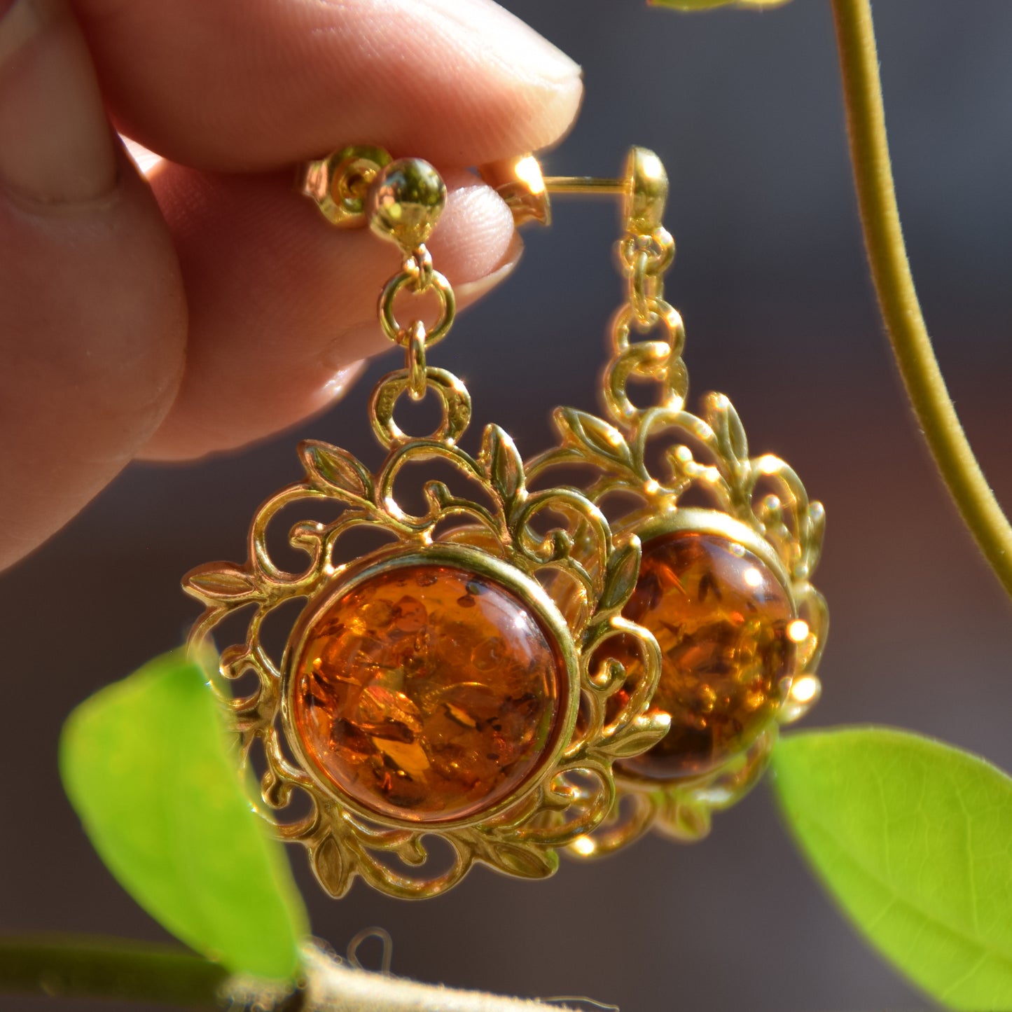Elegant round floral earrings crafted from natural cognac amber and 18k gold-plated 925 sterling silver, MJ Baltica, BZK180