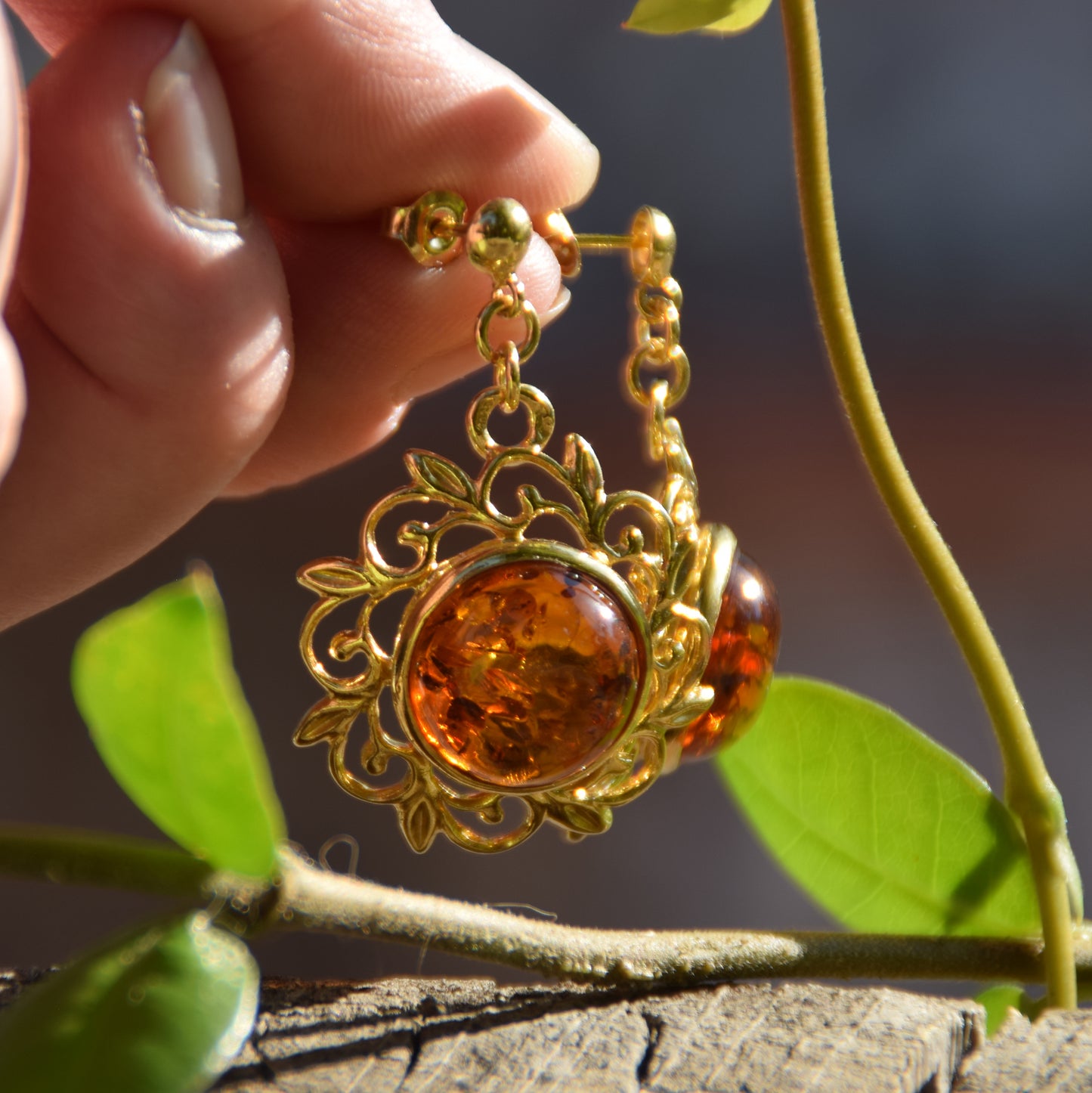 Elegant round floral earrings crafted from natural cognac amber and 18k gold-plated 925 sterling silver, MJ Baltica, BZK180