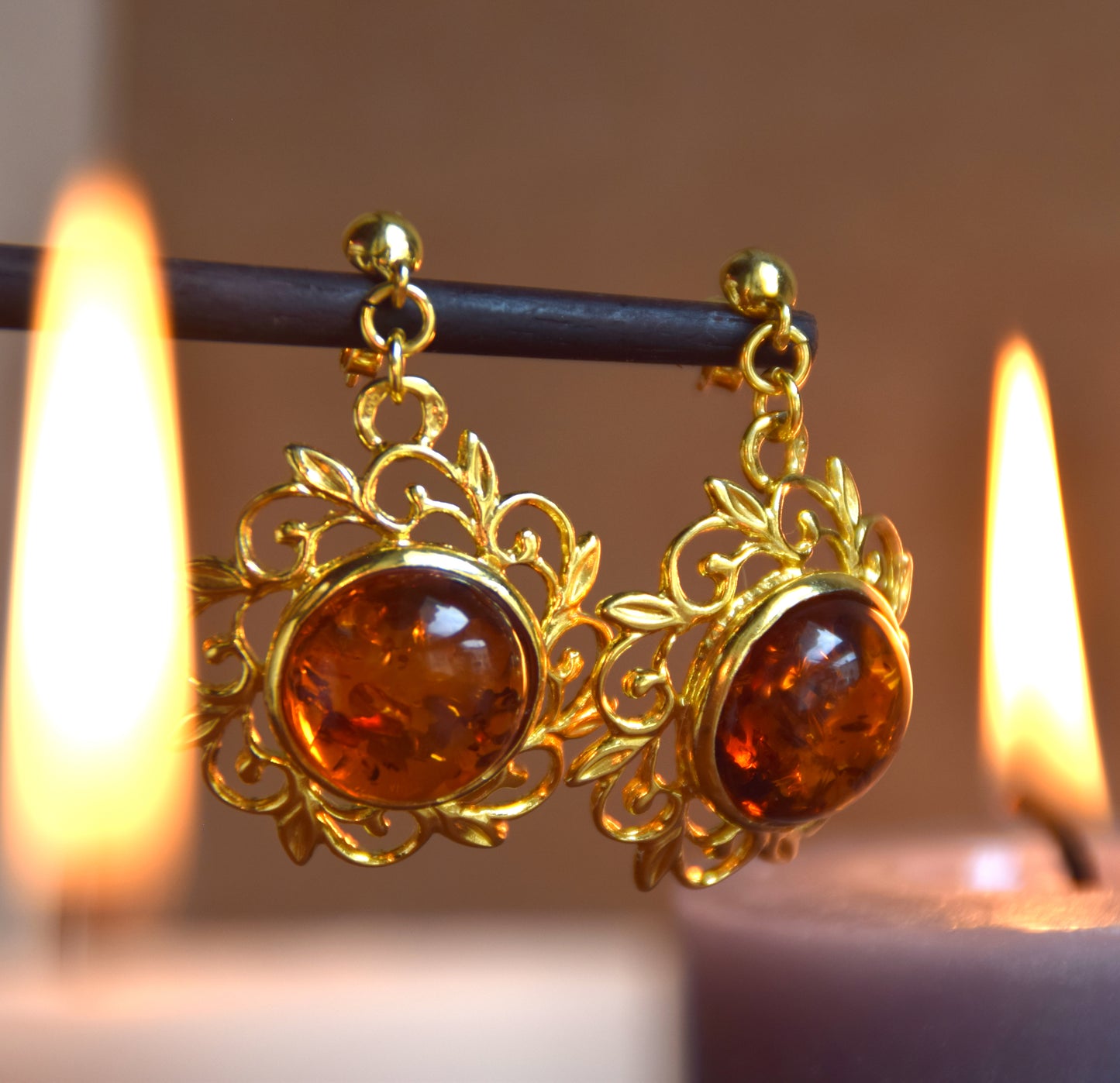 Elegant round floral earrings crafted from natural cognac amber and 18k gold-plated 925 sterling silver, MJ Baltica, BZK180