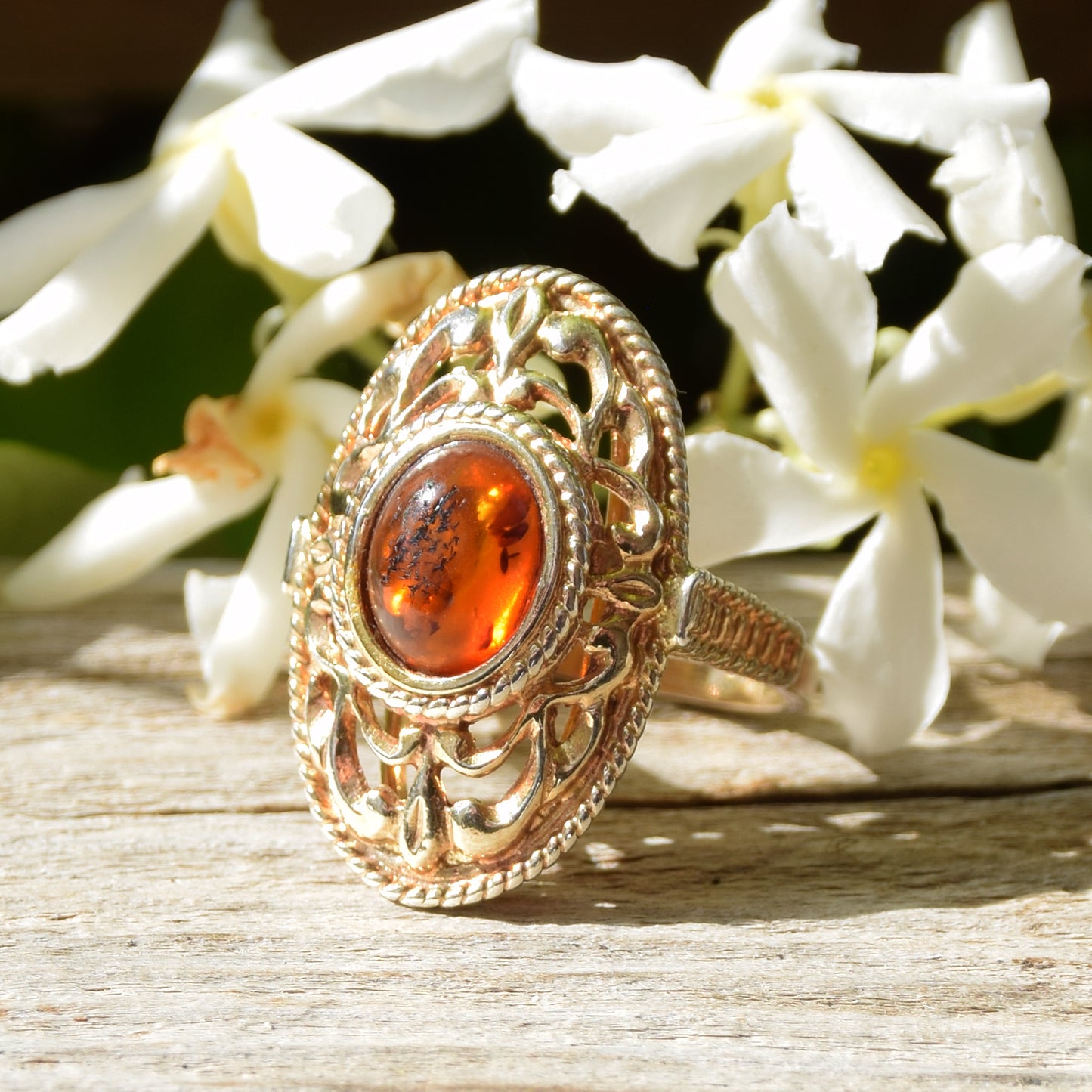 Tall Victorian-style ring made with cognac-colored natural amber and 18k gold-plated silver, MJ Baltica, BZP024
