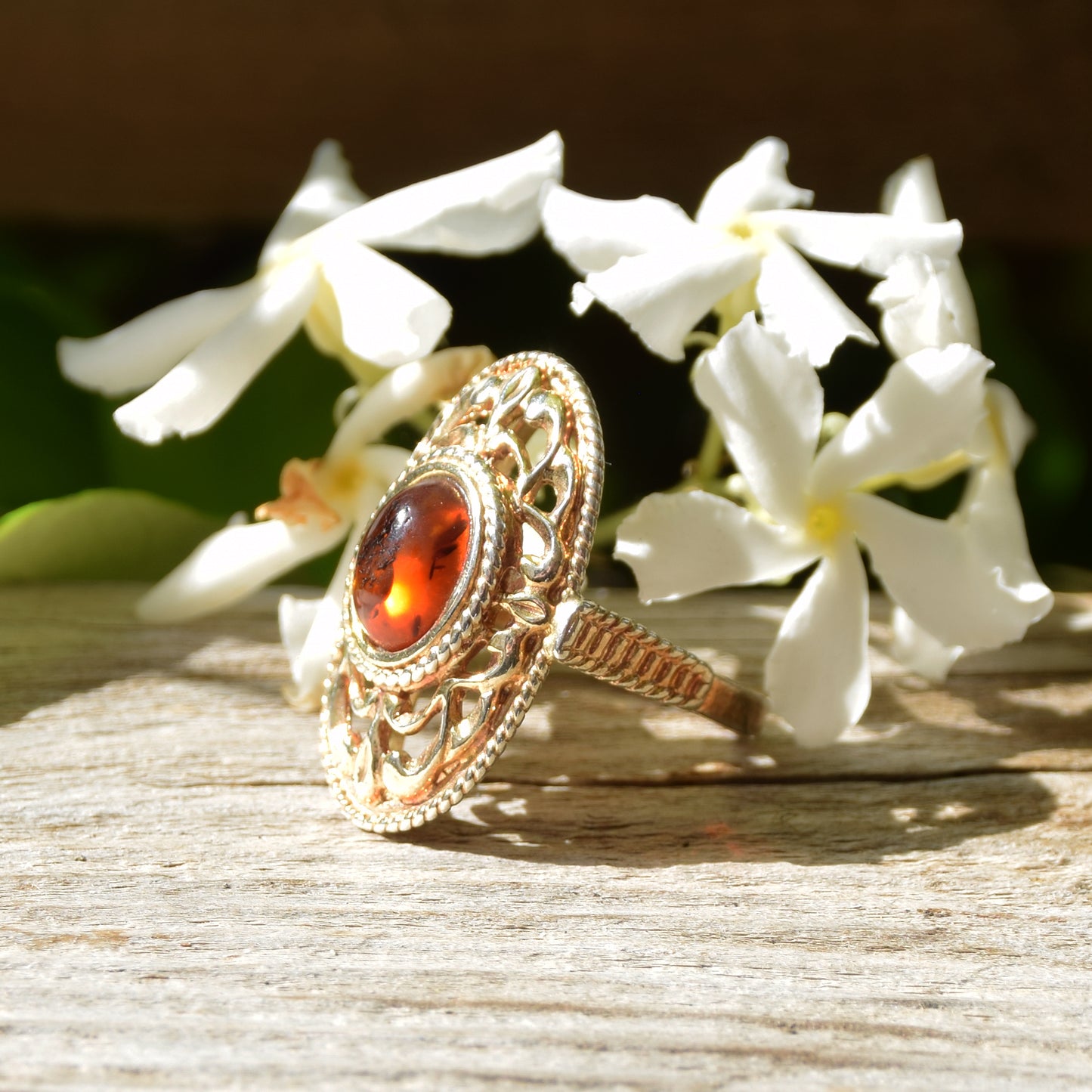 Tall Victorian-style ring made with cognac-colored natural amber and 18k gold-plated silver, MJ Baltica, BZP024