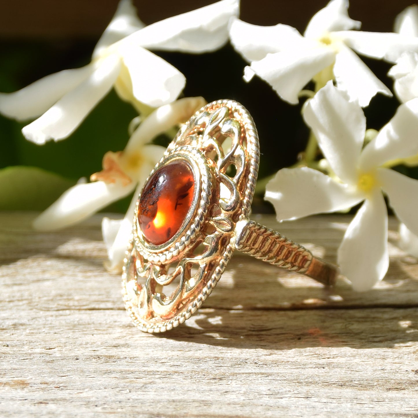 Tall Victorian-style ring made with cognac-colored natural amber and 18k gold-plated silver, MJ Baltica, BZP024