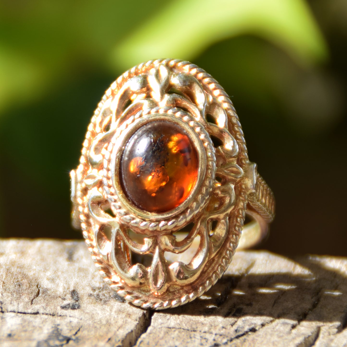 Tall Victorian-style ring made with cognac-colored natural amber and 18k gold-plated silver, MJ Baltica, BZP024