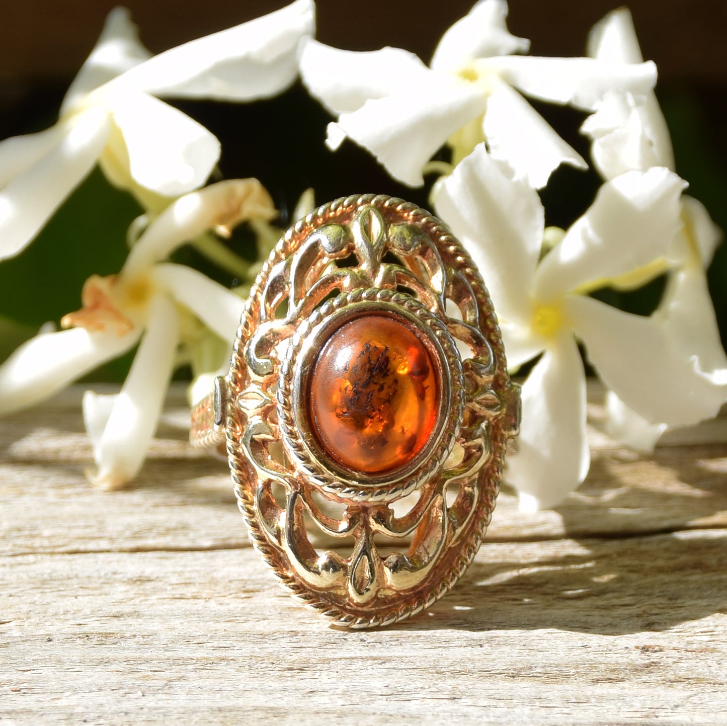 Tall Victorian-style ring made with cognac-colored natural amber and 18k gold-plated silver, MJ Baltica, BZP024