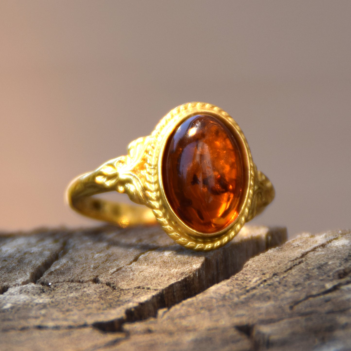 Classic oval ring in vintage style made with natural cognac-colored Amber and 18k Gold-plated Silver, MJ Baltica, BZP034