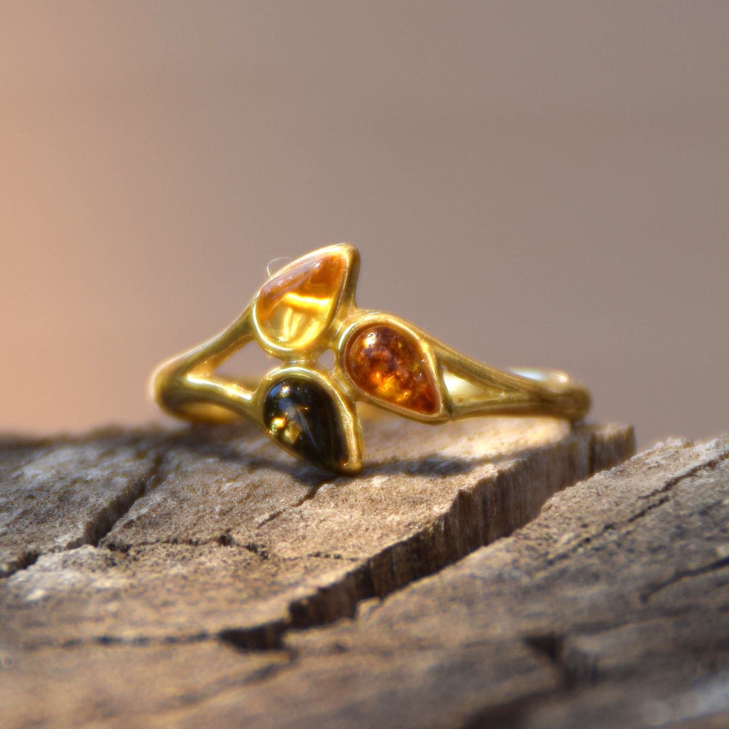 Delicate luminous floral-style ring created with natural Amber of various shades and 18k Gold plated Silver, MJ Baltica, BZP046