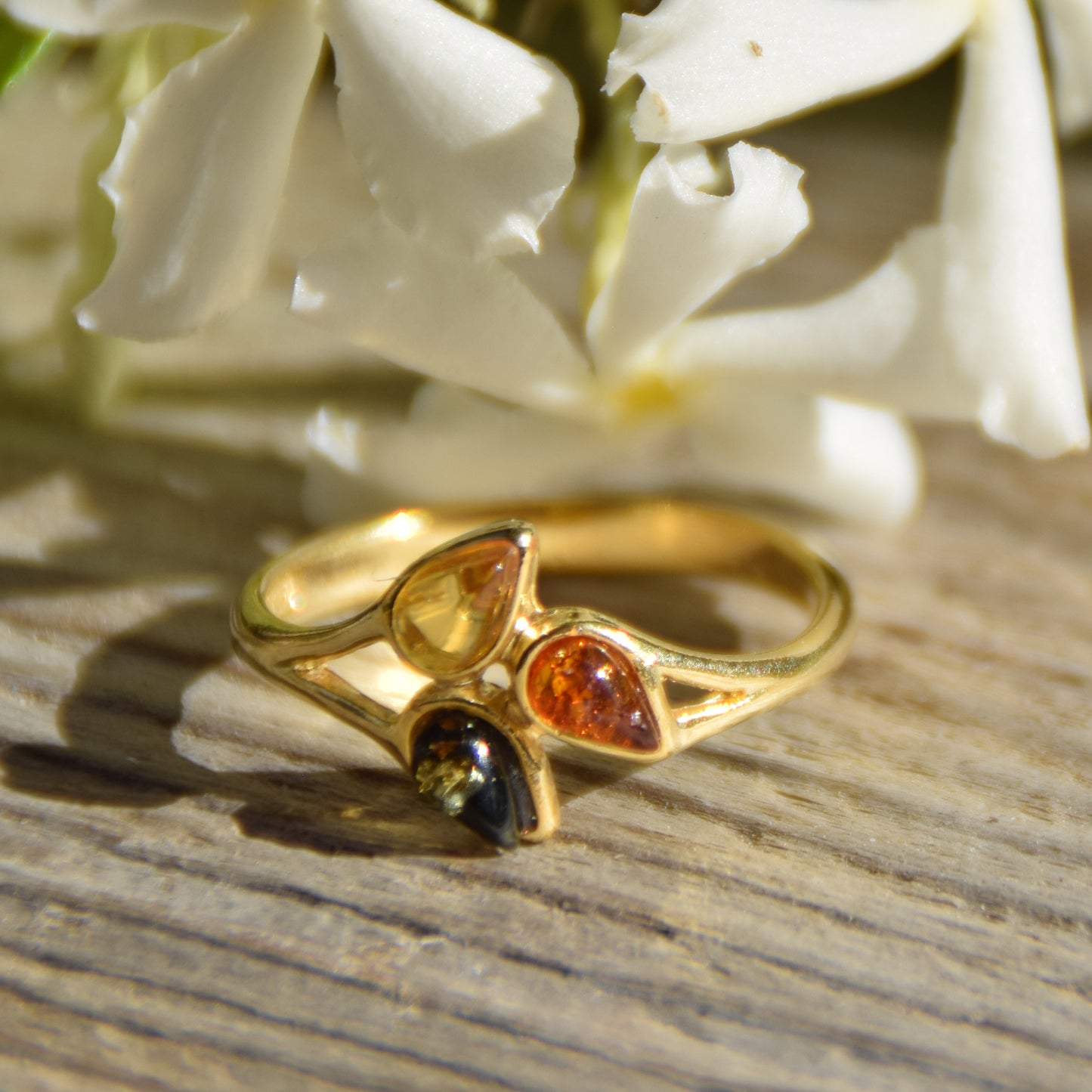 Delicate luminous floral-style ring created with natural Amber of various shades and 18k Gold plated Silver, MJ Baltica, BZP046
