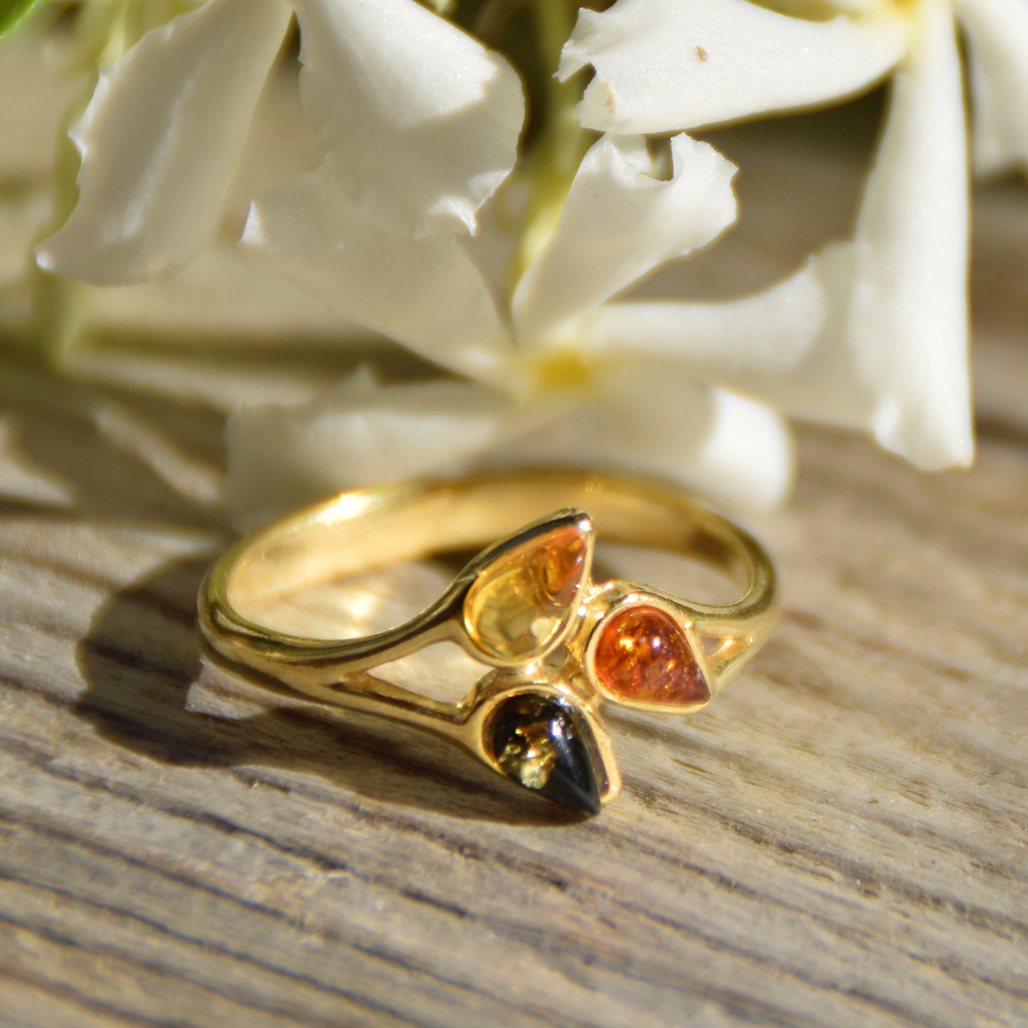 Delicate luminous floral-style ring created with natural Amber of various shades and 18k Gold plated Silver, MJ Baltica, BZP046
