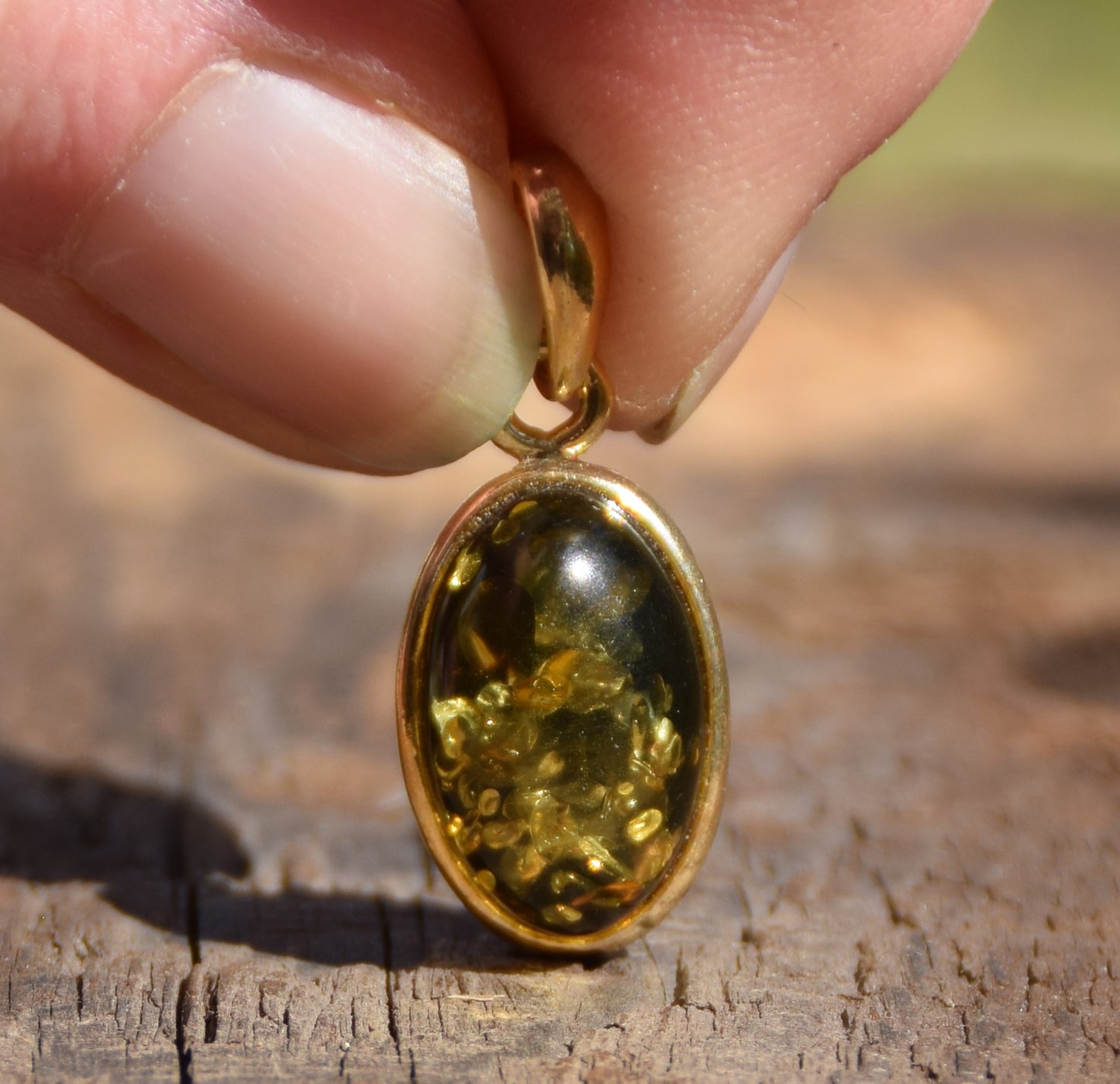Classic oval pendant featuring natural green Amber and 18k Gold-plated Sterling Silver, MJ Baltica, BZW018