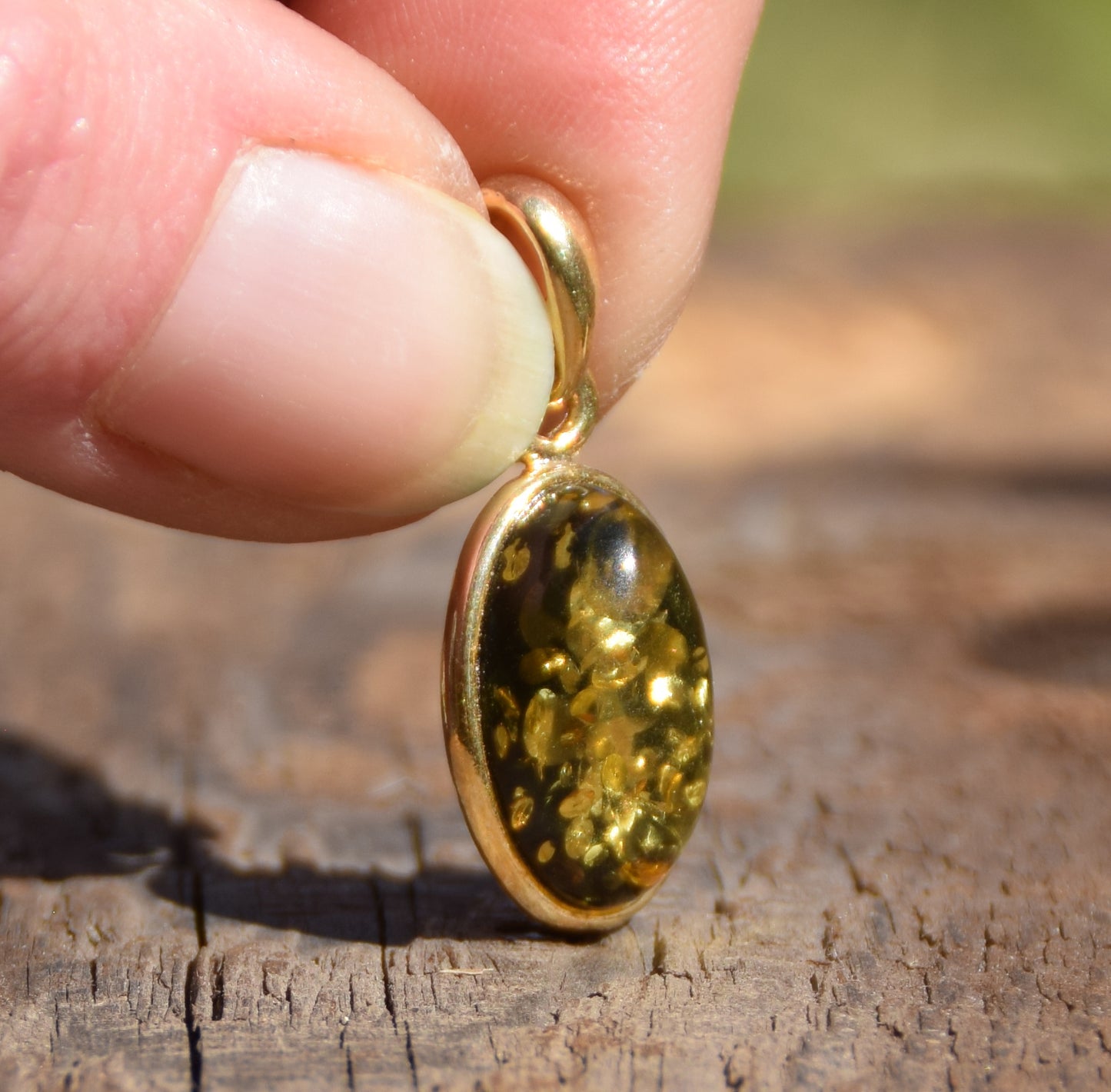 Classic oval pendant featuring natural green Amber and 18k Gold-plated Sterling Silver, MJ Baltica, BZW018