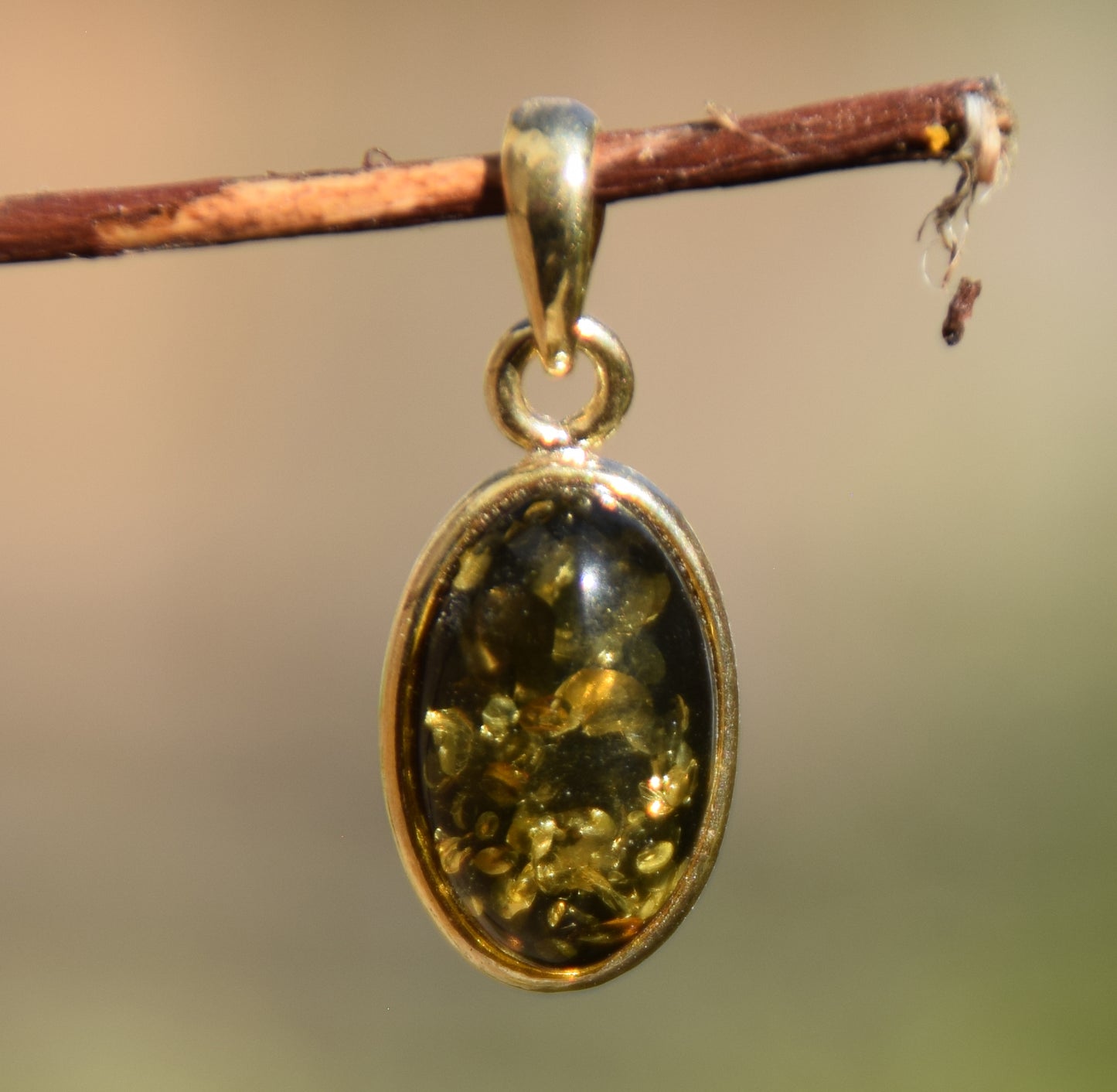 Classic oval pendant featuring natural green Amber and 18k Gold-plated Sterling Silver, MJ Baltica, BZW018