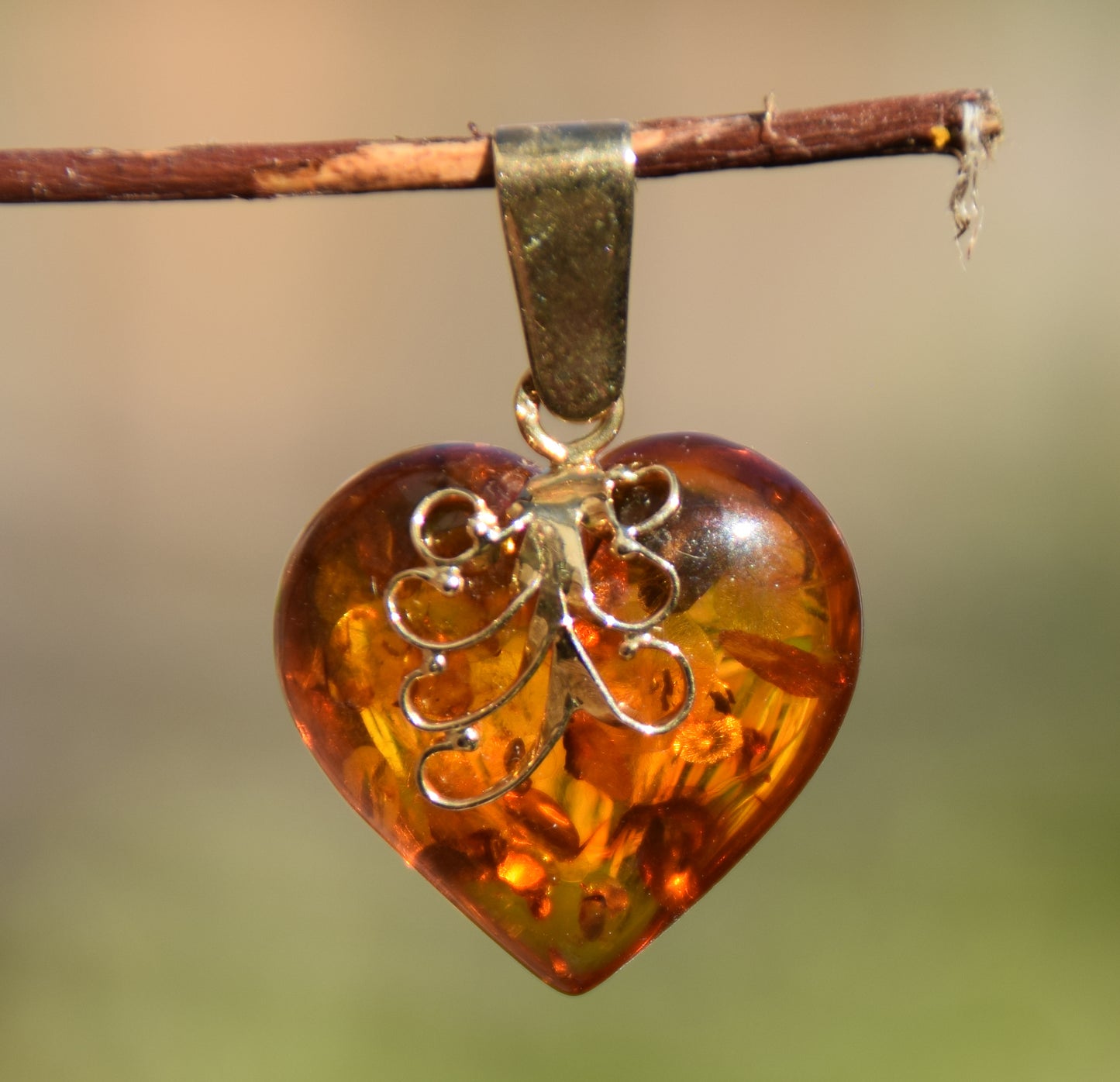Romantic pendant with large cognac-colored natural amber heart and 18k gold-plated silver, MJ Baltica, BZW077