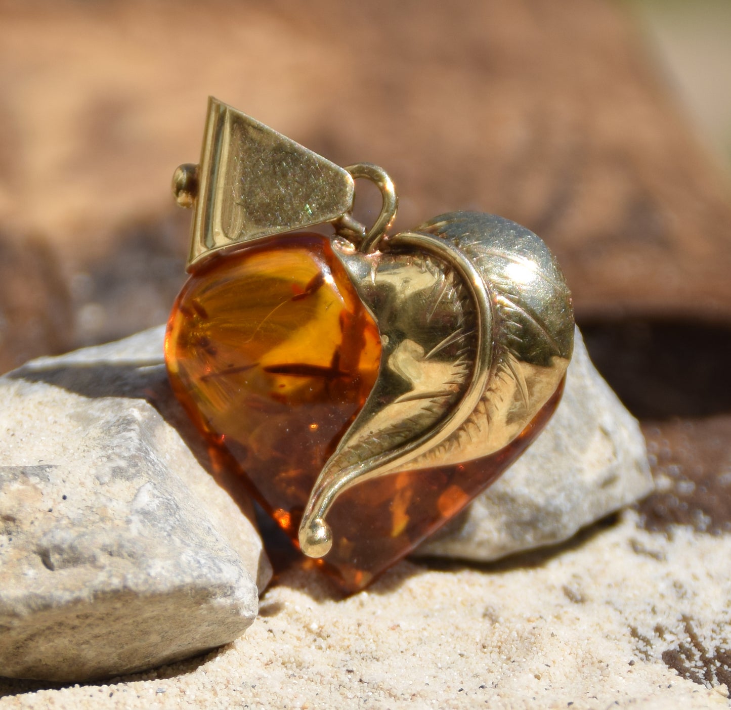 Romantic pendant with a large heart covered with natural cognac-colored Amber leaf and 18k Gold-plated Silver, MJ Baltica, BZW123