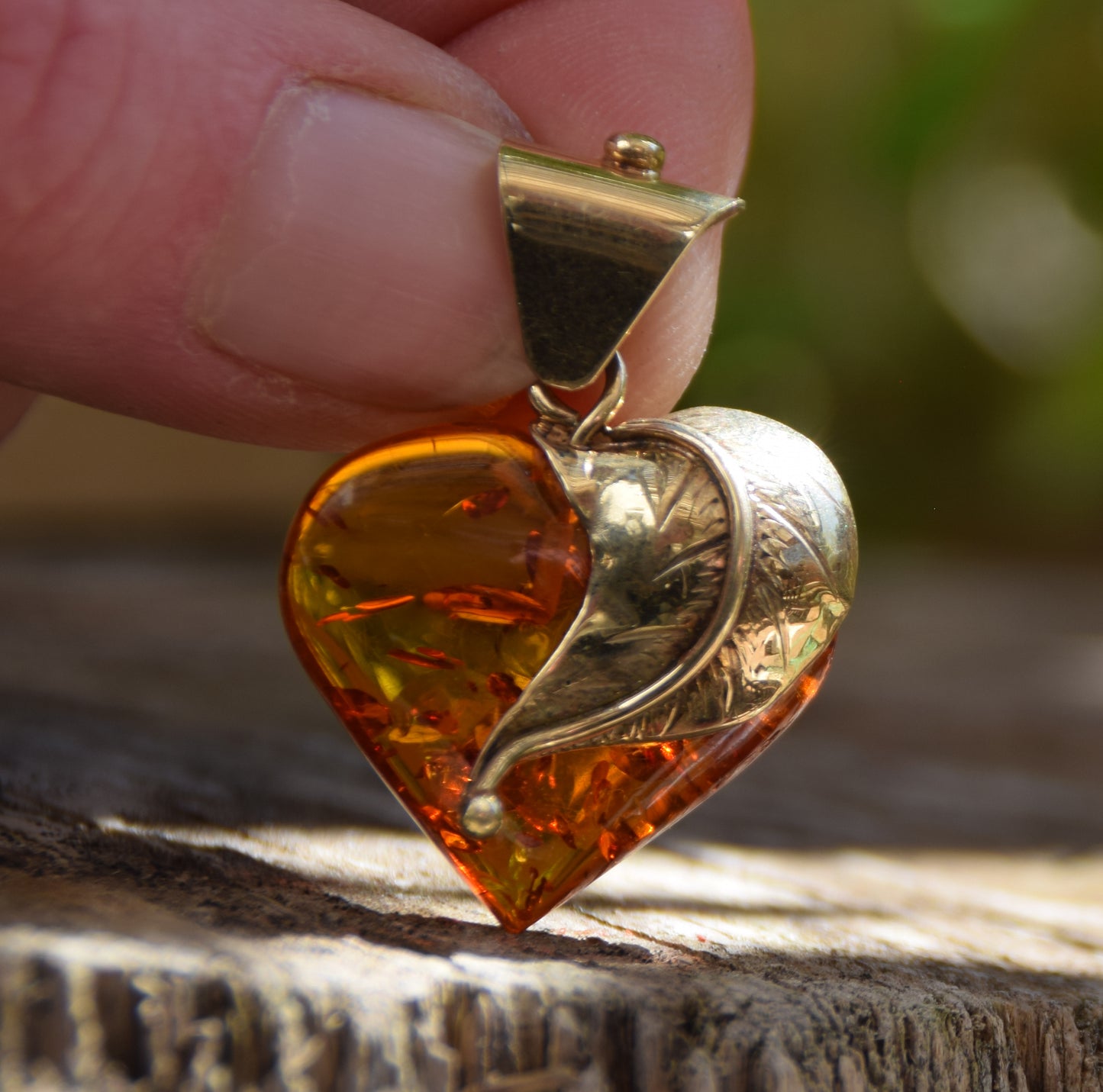 Romantic pendant with a large heart covered with natural cognac-colored Amber leaf and 18k Gold-plated Silver, MJ Baltica, BZW123
