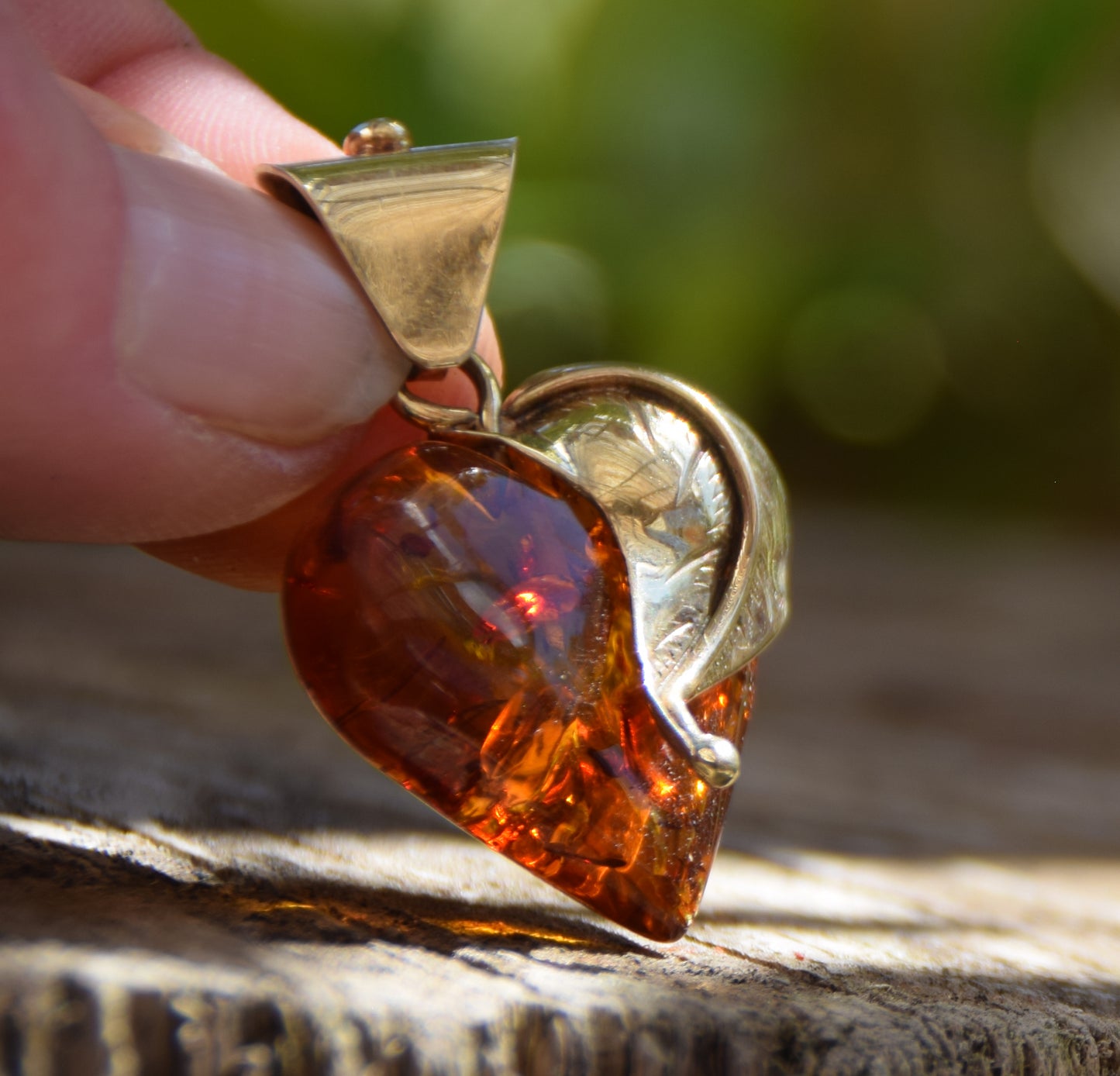 Romantic pendant with a large heart covered with natural cognac-colored Amber leaf and 18k Gold-plated Silver, MJ Baltica, BZW123
