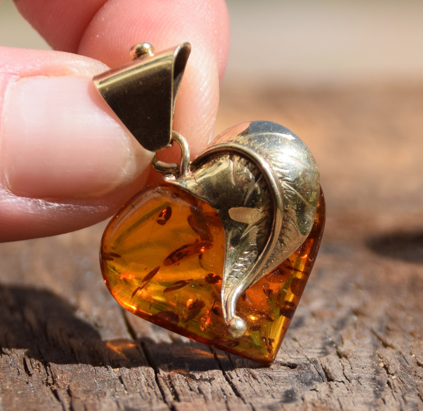 Romantic pendant with a large heart covered with natural cognac-colored Amber leaf and 18k Gold-plated Silver, MJ Baltica, BZW123