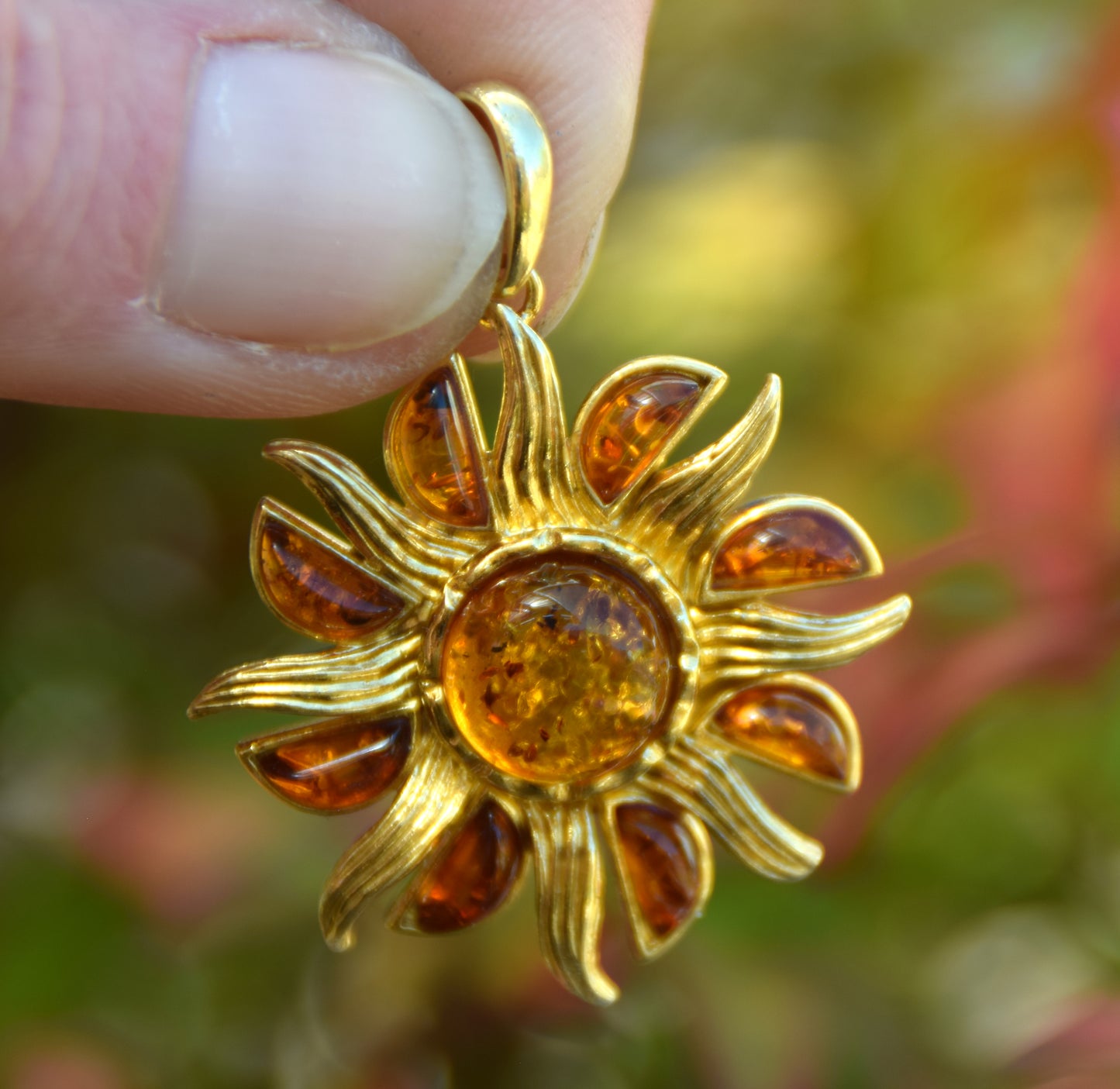 Bright pendant in the shape of a dainty sun in natural cognac Amber and 925 Sterling Silver, 14k Gold Plated, MJ Baltica, BZW140