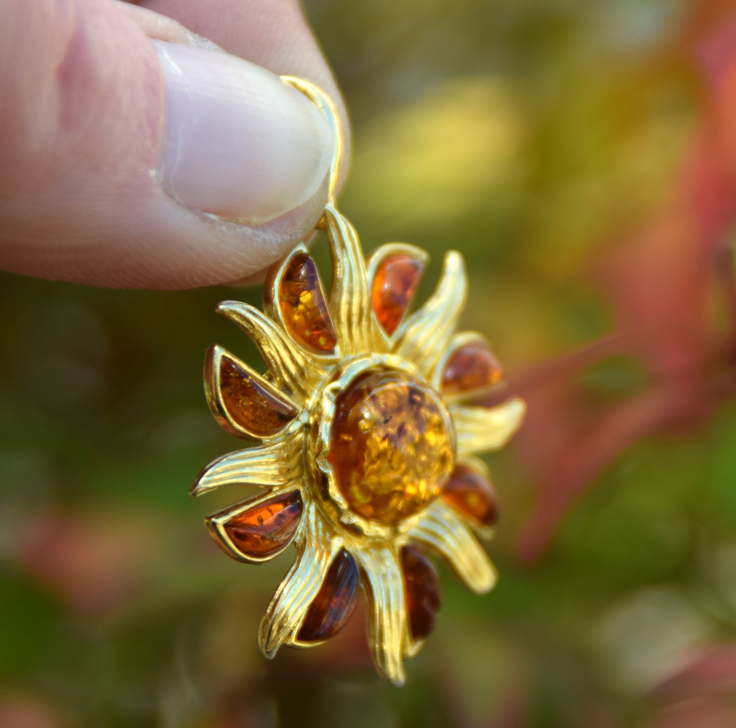 Bright pendant in the shape of a dainty sun in natural cognac Amber and 925 Sterling Silver, 14k Gold Plated, MJ Baltica, BZW140