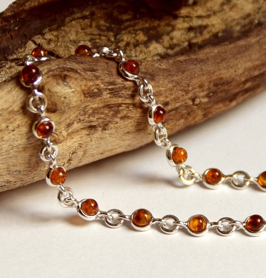 Delicate adjustable chain bracelet crafted with cognac-colored natural Amber and 925 Sterling Silver, MJ Baltica, BB014