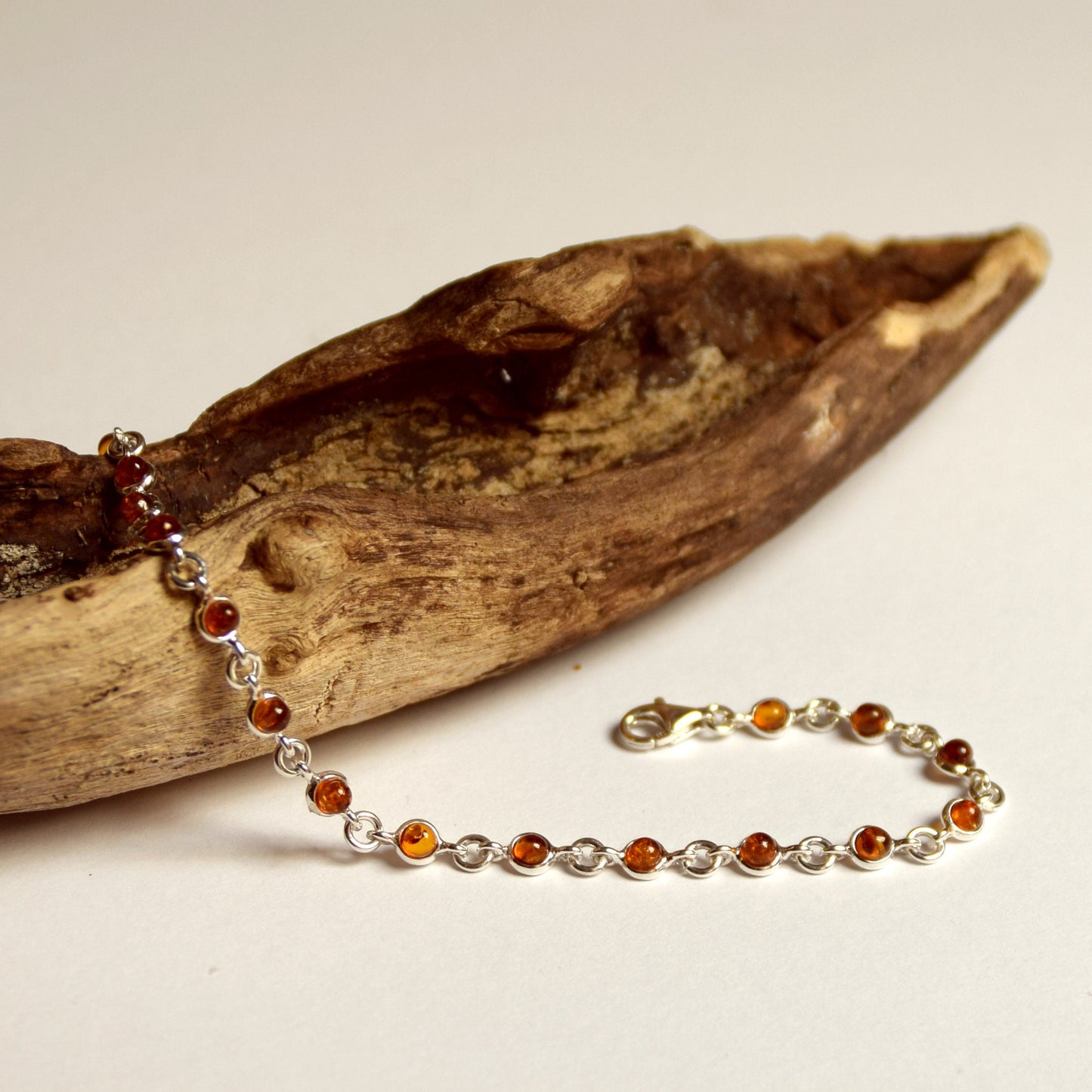 Delicate adjustable chain bracelet crafted with cognac-colored natural Amber and 925 Sterling Silver, MJ Baltica, BB014