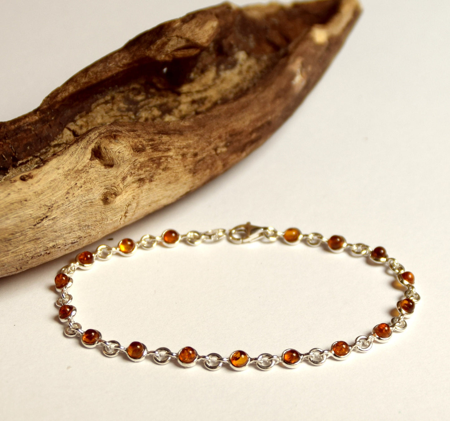 Delicate adjustable chain bracelet crafted with cognac-colored natural Amber and 925 Sterling Silver, MJ Baltica, BB014