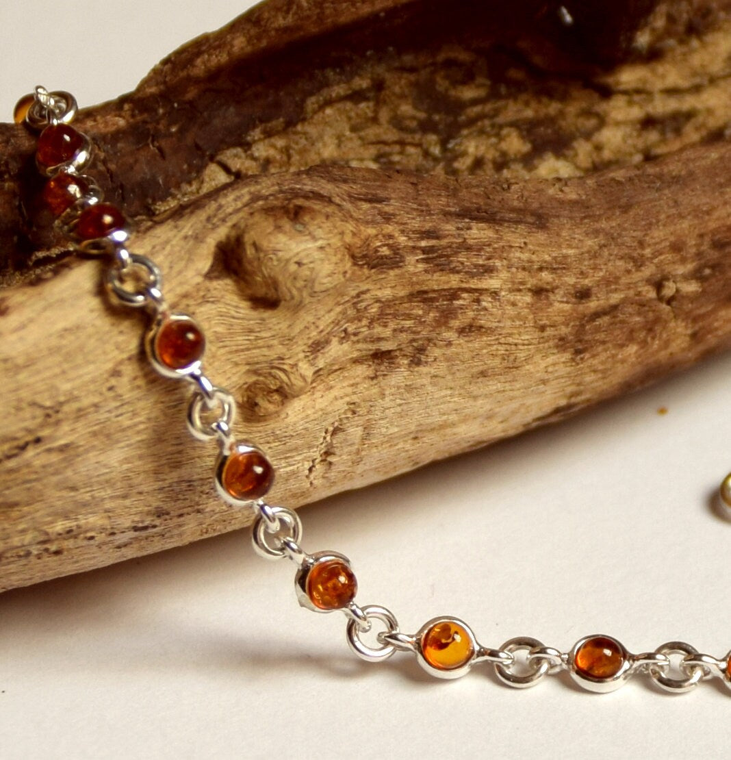 Delicate adjustable chain bracelet crafted with cognac-colored natural Amber and 925 Sterling Silver, MJ Baltica, BB014