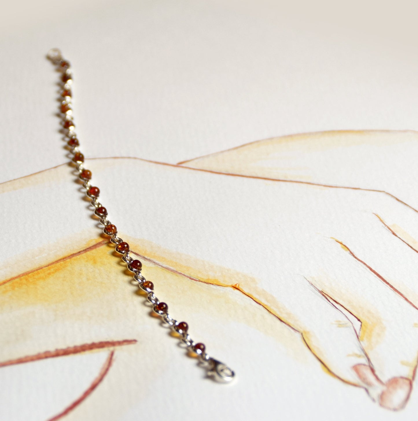 Delicate adjustable chain bracelet crafted with cognac-colored natural Amber and 925 Sterling Silver, MJ Baltica, BB014