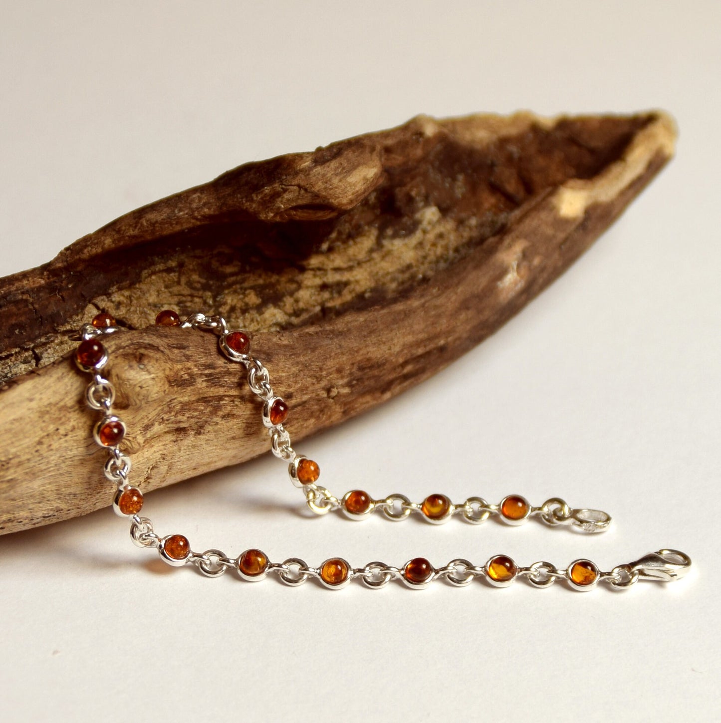Delicate adjustable chain bracelet crafted with cognac-colored natural Amber and 925 Sterling Silver, MJ Baltica, BB014
