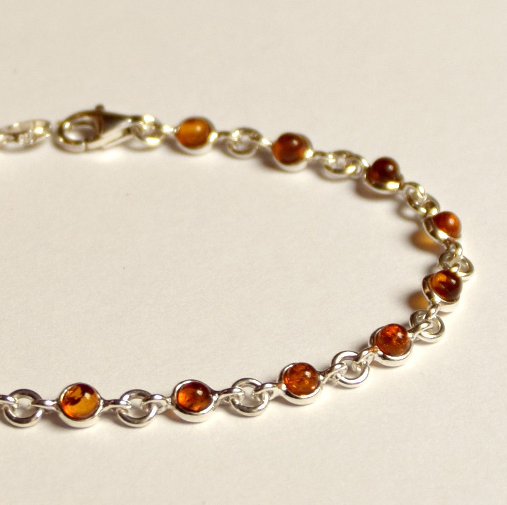 Delicate adjustable chain bracelet crafted with cognac-colored natural Amber and 925 Sterling Silver, MJ Baltica, BB014