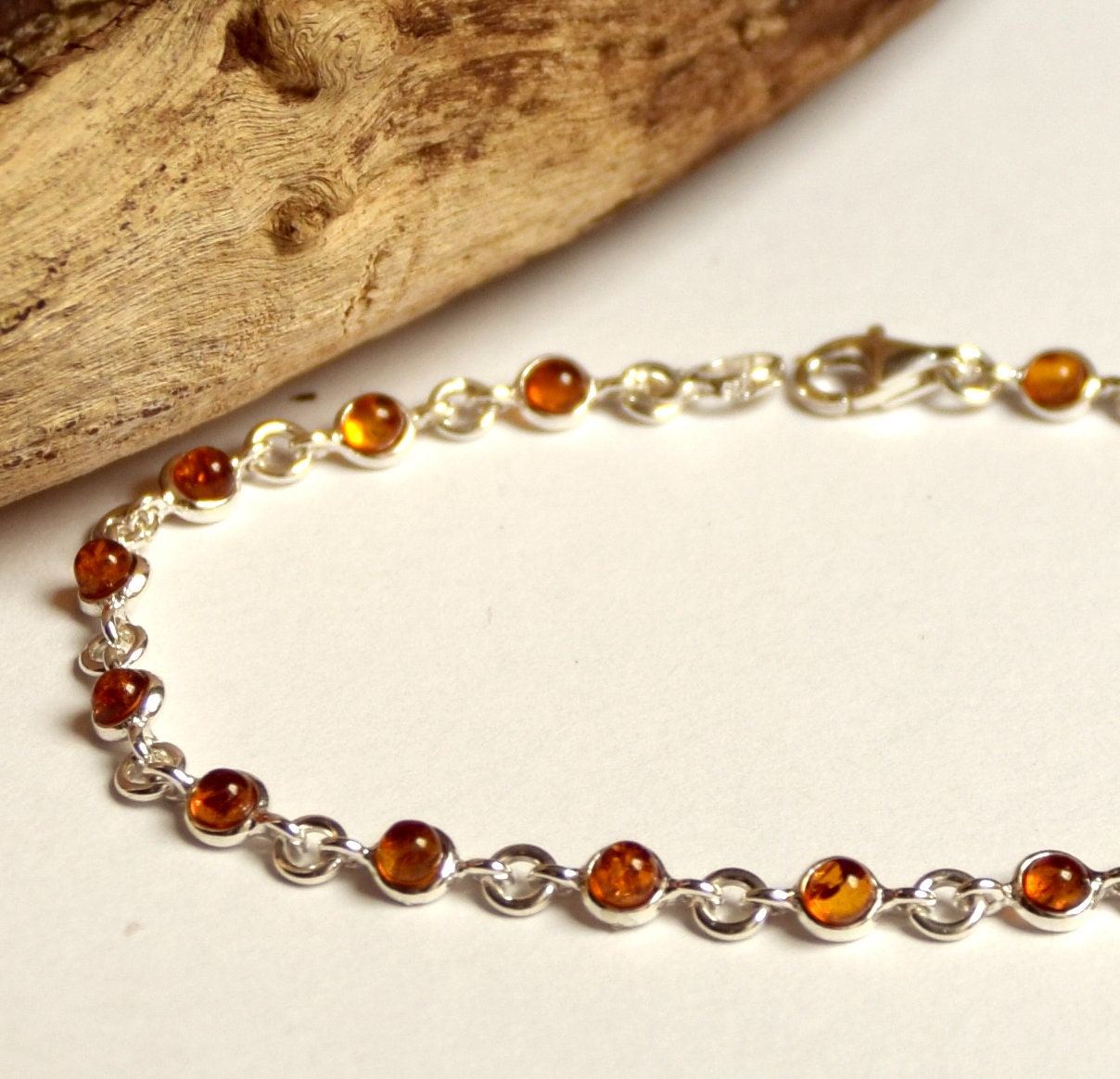 Delicate adjustable chain bracelet crafted with cognac-colored natural Amber and 925 Sterling Silver, MJ Baltica, BB014