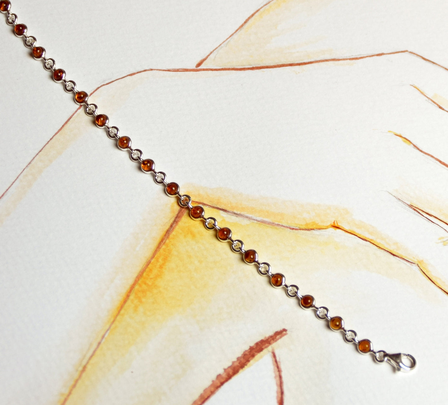 Delicate adjustable chain bracelet crafted with cognac-colored natural Amber and 925 Sterling Silver, MJ Baltica, BB014